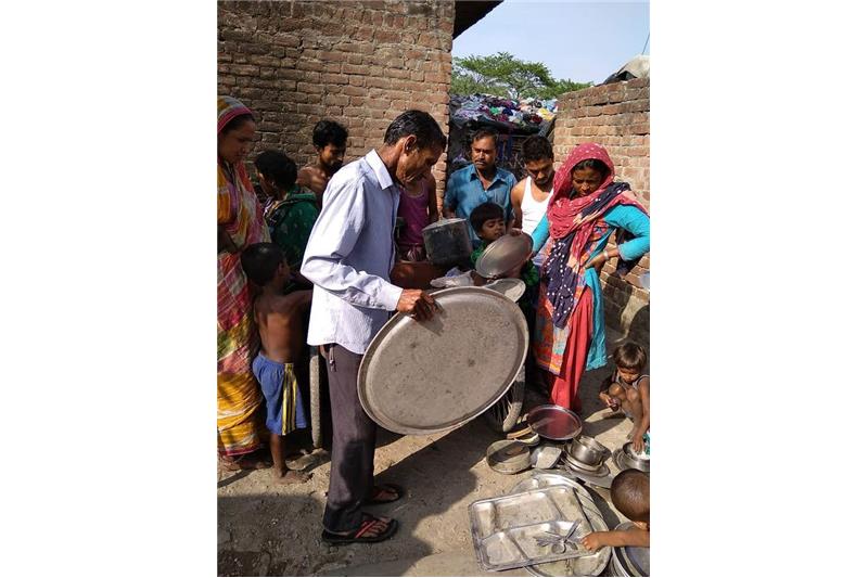 Distribution of old clothes and utensils in our Neighborhood 