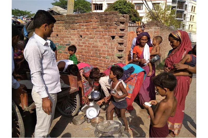 Distribution of old clothes and utensils in our Neighborhood 