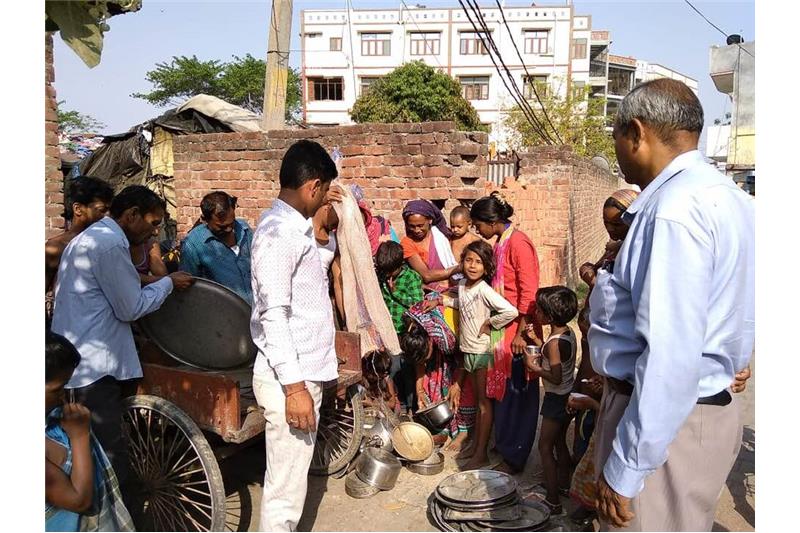 Distribution of old clothes and utensils in our Neighborhood 