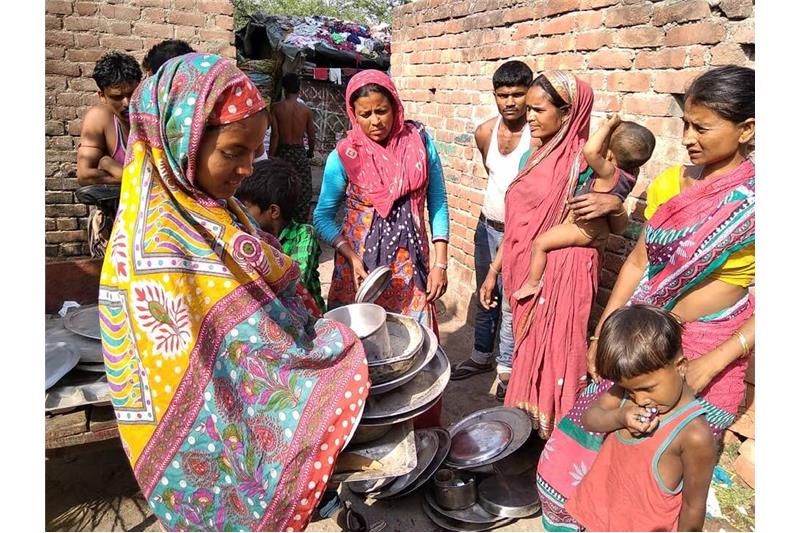 Distribution of old clothes and utensils in our Neighborhood 