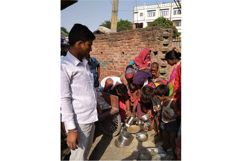Distribution of old clothes and utensils in our Neighborhood 